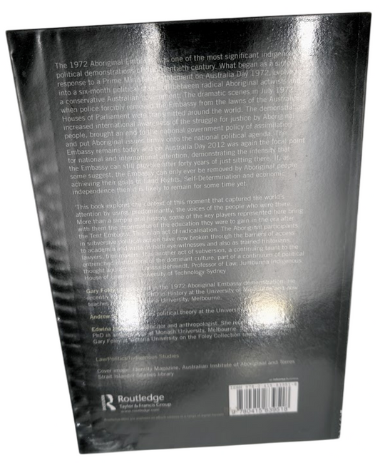 Back cover of a book with text and a barcode on a white background