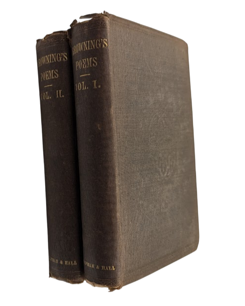 Two vintage books stacked on a white background