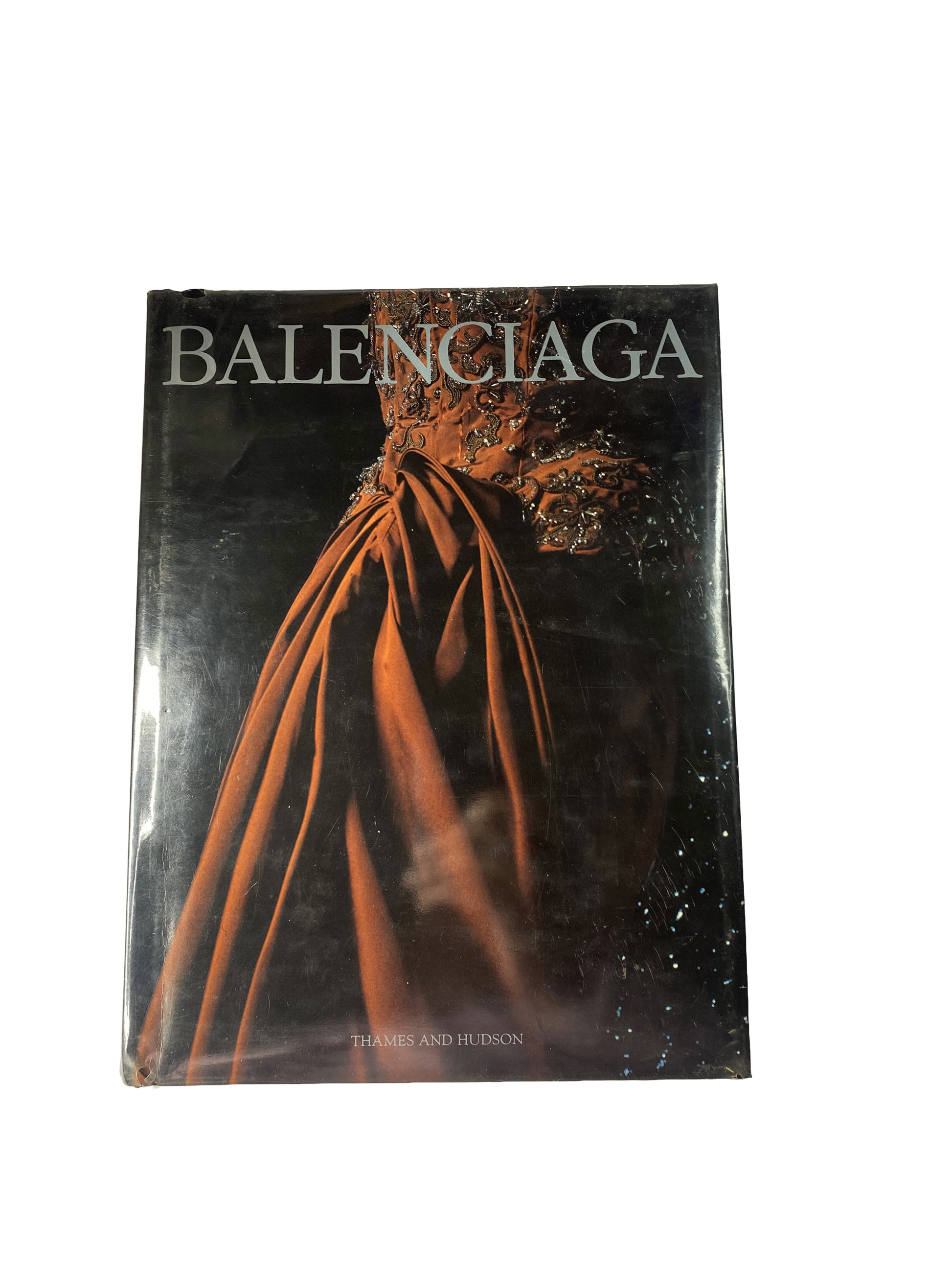 Book cover of 'Balenciaga' by Thames and Hudson with a dark background and Balenciaga logo.