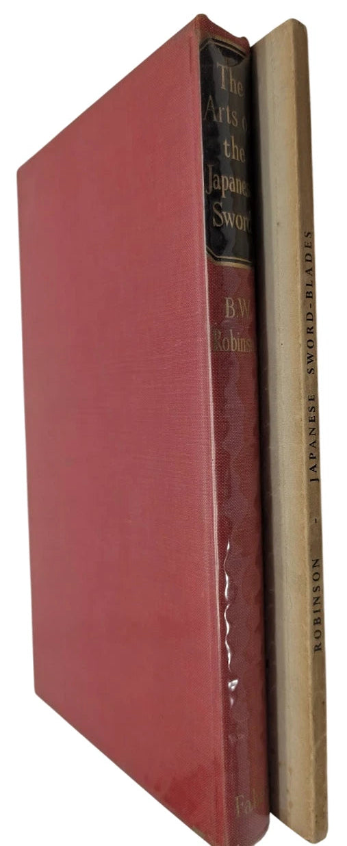 Two books about swords stacked on top of each other with a red book on top